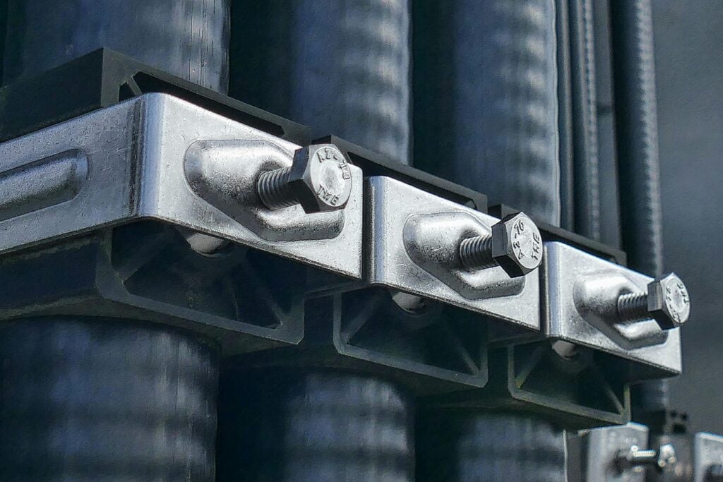 Macro photo of industrial components; nuts, bolts and machinery